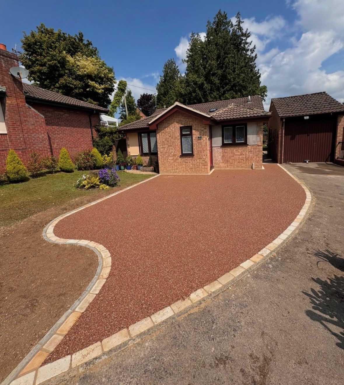 Luxury home with H Driveways resin-bound driveway at golden hour